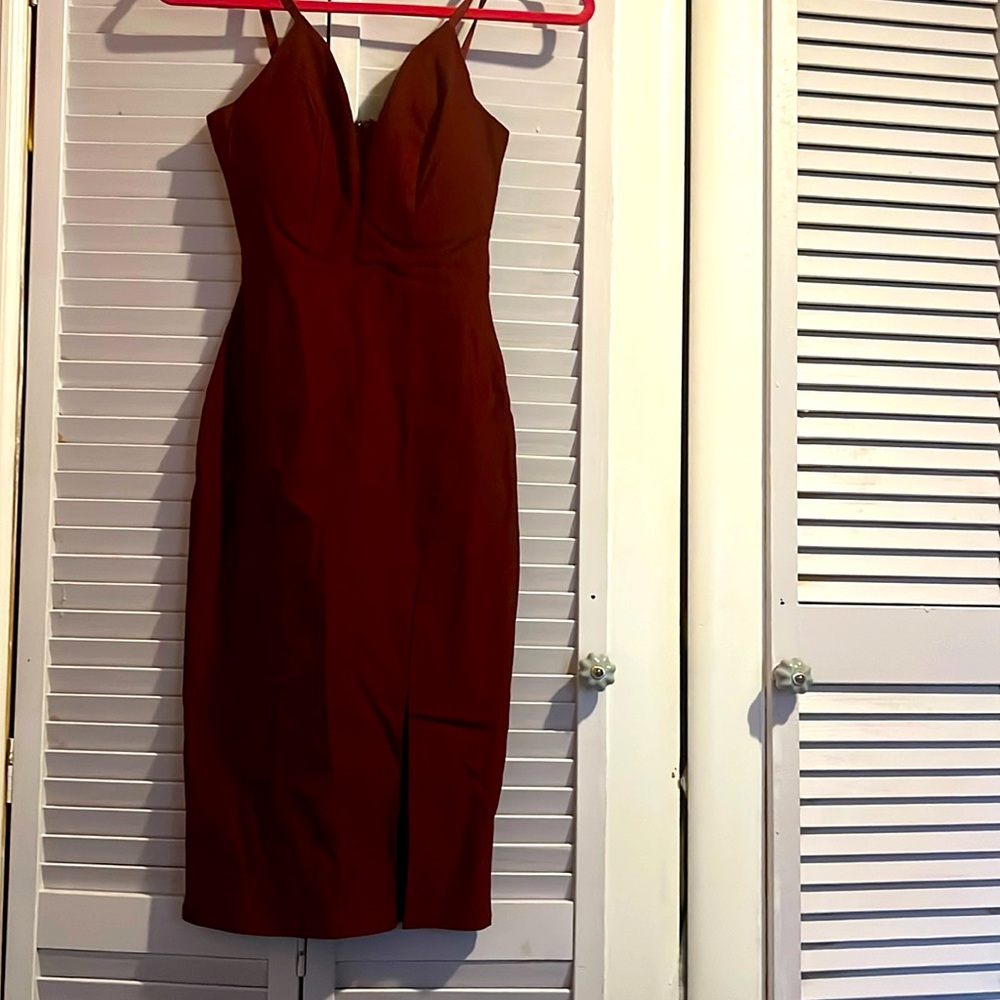 Revamped Premium Collection burgundy mid length side slit dress. Size medium.